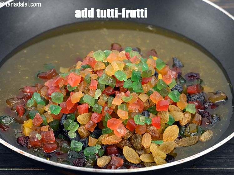 Step 10 – Add 1/2 cup&nbsp;<a href="https://www.tarladalal.com/glossary-tutti-frutti-candied-fruit-cubes-candied-raw-papaya-1275i">tutti-frutti</a>.