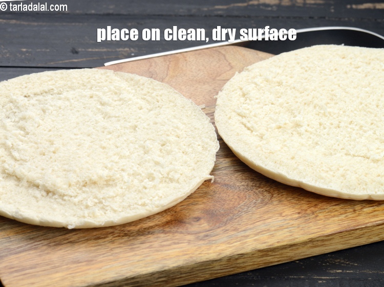 Step 9 – Cut a pizza base into half horizontally using a sharp knife or a thread.&nbsp;