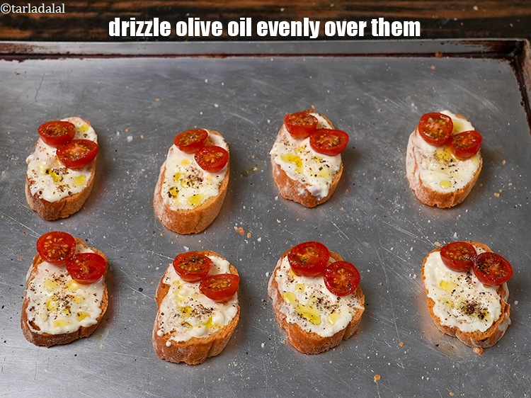 Step 9 – Drizzle &frac14; tsp of <a href="https://www.tarladalal.com/glossary-olive-oil-451i">olive oil</a> evenly over them.