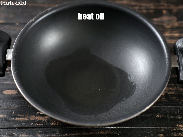 Step 9 – In a deep non- stick pan, heat 2 tsp oil.