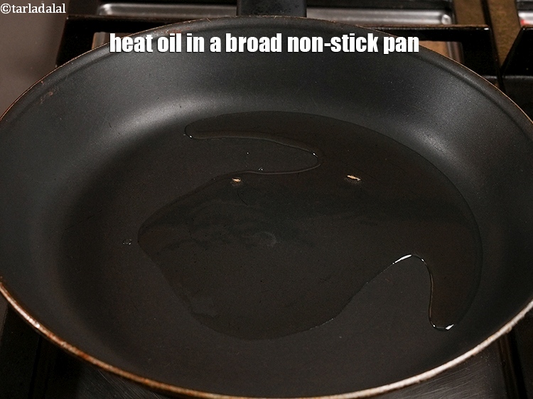 Step 9 – Heat 1 tbsp <a href="https://www.tarladalal.com/glossary-oil-671i">oil</a> in a broad non-stick pan.