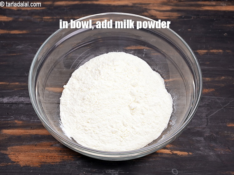 Step 10 – In a deep bowl, add 1 cup <a href="https://www.tarladalal.com/glossary-milk-powder-517i">milk powder</a>.