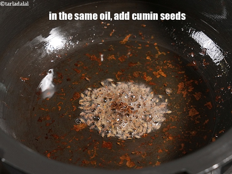 Step 9 – In the same oil, add &frac12; tsp <a href="https://www.tarladalal.com/glossary-cumin-seeds-jeera-zeera-381i">cumin seeds (jeera)</a>.