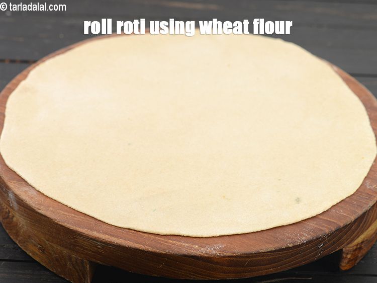 Step 9 – Roll the 9 inch roti using little whole wheat flour.