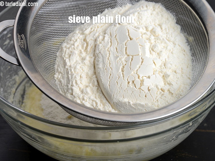 Step 11 – Sieve 1 cup of&nbsp;<a href="https://www.tarladalal.com/glossary-plain-flour-maida-188i">plain flour (maida)</a>.
