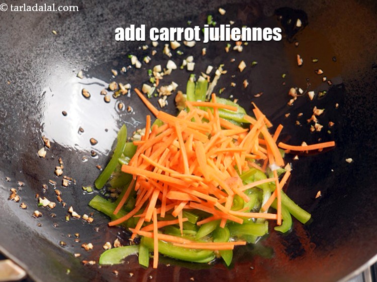Step 9 – Add &frac12; cup <a href="https://www.tarladalal.com/glossary-carrot-juliennes-754i">carrot juliennes</a>.