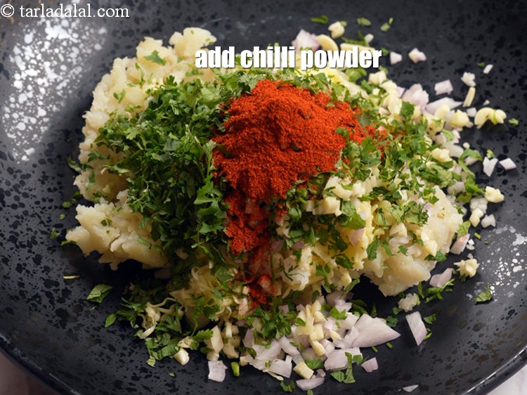 Step 9 – Add 2 tsp&nbsp;<a href="https://www.tarladalal.com/glossary-chilli-powder-red-chilli-powder-339i">chilli powder</a>.&nbsp;