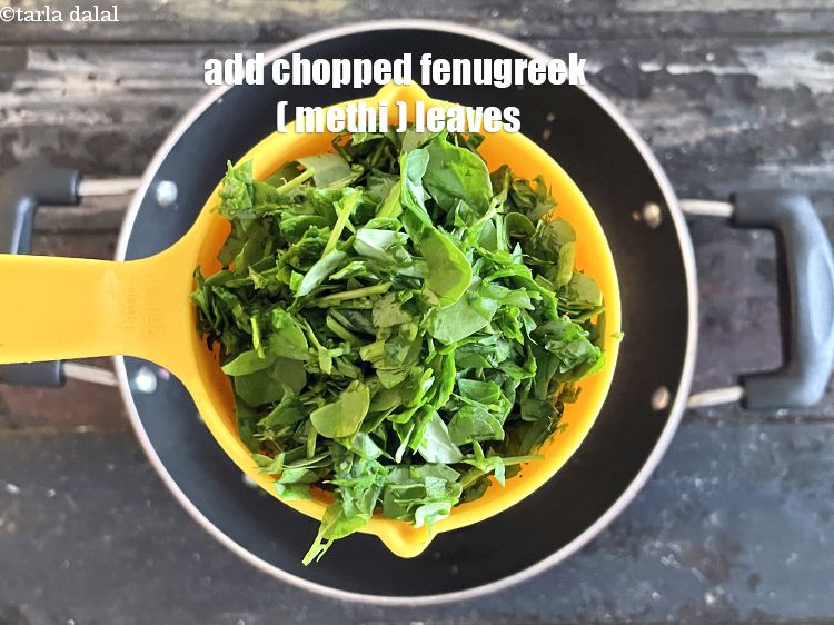 Step 14 – Add&nbsp;<meta charset="UTF-8" />1 1/2 cups&nbsp;<a href="glossary-chopped-fenugreek-811i">chopped fenugreek (methi) leaves</a>.