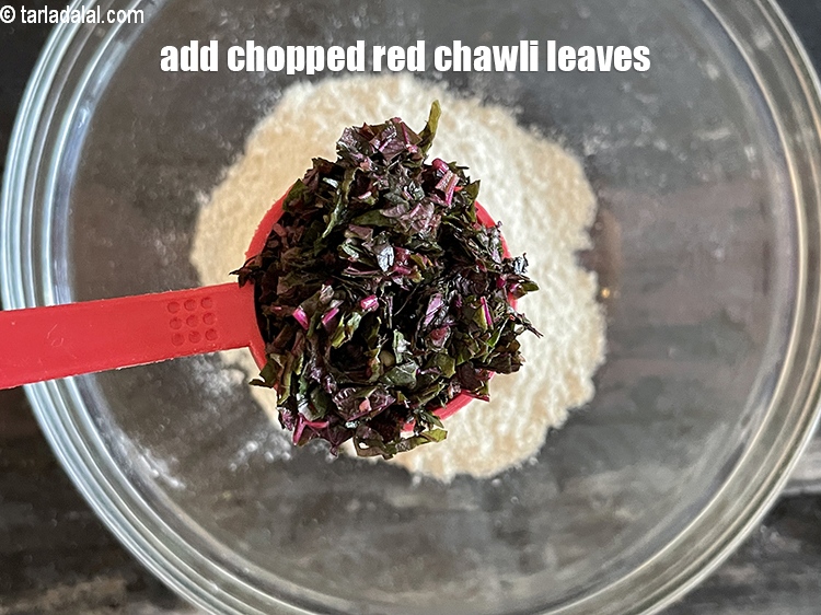 Step 10 – Add&nbsp;<meta charset="UTF-8" />5 tbsp&nbsp;<a href="glossary-chopped-red-chawli-leaves-2738i">chopped red chawli leaves (laal math)</a>.