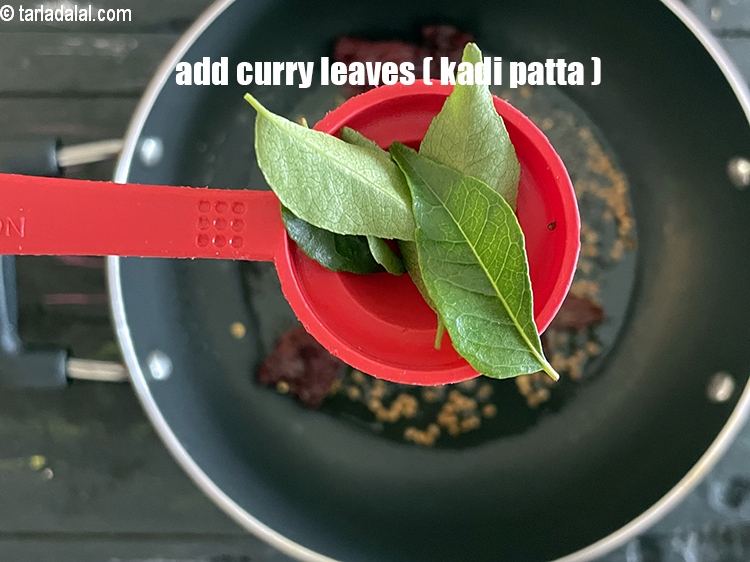 Step 21 – Add&nbsp;<meta charset="UTF-8" />5&nbsp;<a href="glossary-curry-leaves-kadi-patta-kadipatta-388i">curry leaves (kadi patta)</a>.