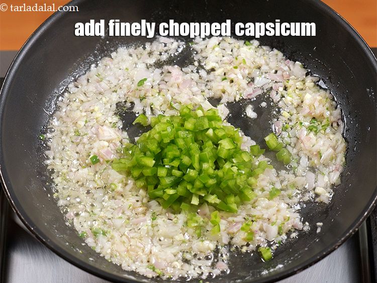 Step 11 – Add &frac14; cup finely <a href="https://www.tarladalal.com/glossary-chopped-capsicum-164i">chopped capsicum</a>.