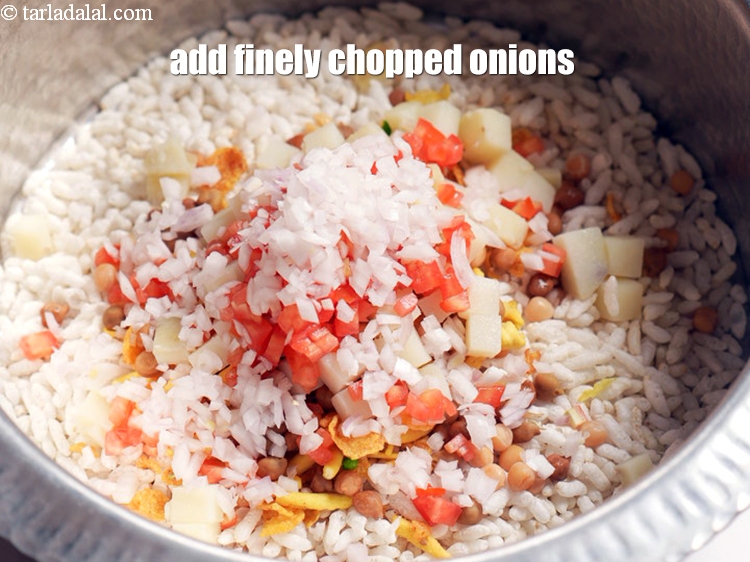 Step 10 – Add &frac12; cup finely <a href="https://www.tarladalal.com/glossary-chopped-onions-722i">chopped onions</a>.