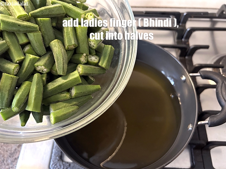 Step 9 – Add&nbsp;<!--%3Cmeta%20charset%3D%22UTF-8%22%20%2F%3E-->4 cups&nbsp;<a href="glossary-ladies-finger-bhindi-okra-bhinda-lady-finger-491i">ladies finger (bhindi)</a>&nbsp;, cut into halves.