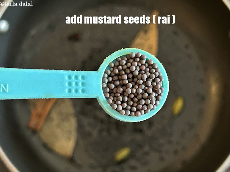 Step 9 – Add&nbsp;<meta charset="UTF-8" />1/2 tsp&nbsp;<a href="glossary-mustard-seeds-sarson-rai-sarson-ke-beej-525i">mustard seeds ( rai / sarson)</a>.