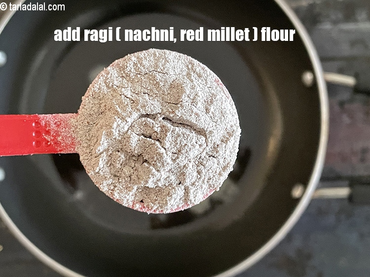 Step 9 – Add&nbsp;<meta charset="UTF-8" />2 tbsp&nbsp; <a href="glossary-ragi-flour-nachni-flour-nachni-ka-atta-red-millet-flour-1115i">ragi (nachni / red millet) flour</a>.