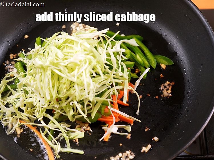 Step 10 – Add 1/2 cup thinly <a href="https://www.tarladalal.com/glossary-shredded-cabbage-763i">sliced cabbage</a>.