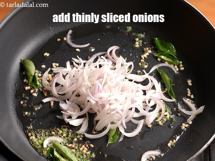 Step 10 – Add &frac12; cup thinly <a href="https://www.tarladalal.com/glossary-sliced-onions-745i">sliced onions</a>.