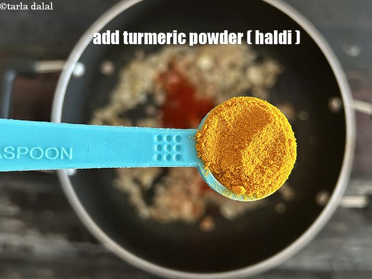 Step 11 – Add&nbsp;<meta charset="UTF-8" />1/2 tsp&nbsp;<a href="glossary-turmeric-powder-haldi-645i">turmeric powder (haldi)</a>.