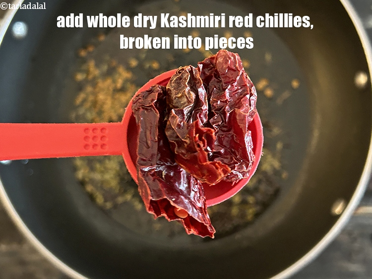 Step 9 – Add&nbsp;<meta charset="UTF-8" />2&nbsp;<a href="glossary-whole-dry-kashmiri-red-chillies-kashmiri-mirch-kashmiri-lal-mirch-332i">whole dry kashmiri red chillies</a>&nbsp;, broken into small pieces.