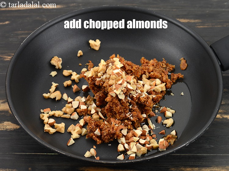 Step 9 – Add 2 tbsp <a href="https://www.tarladalal.com/glossary-chopped-almonds-865i">chopped almonds (badam)</a>.