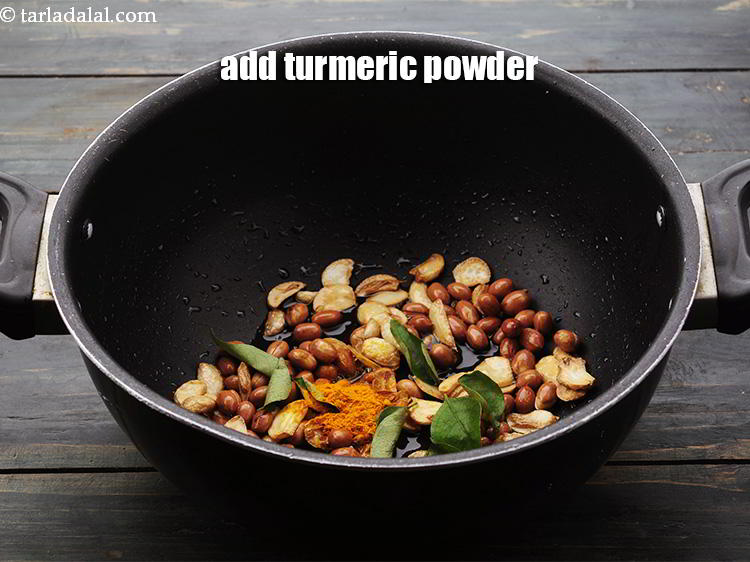 Step 9 – Add the <a href="https://www.tarladalal.com/glossary-turmeric-powder-haldi-645i" target="_blank">turmeric powder</a>.
