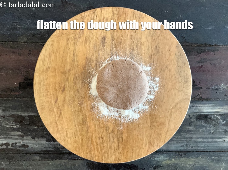 Step 11 – Flatten the dough into a circular shape with your hands.