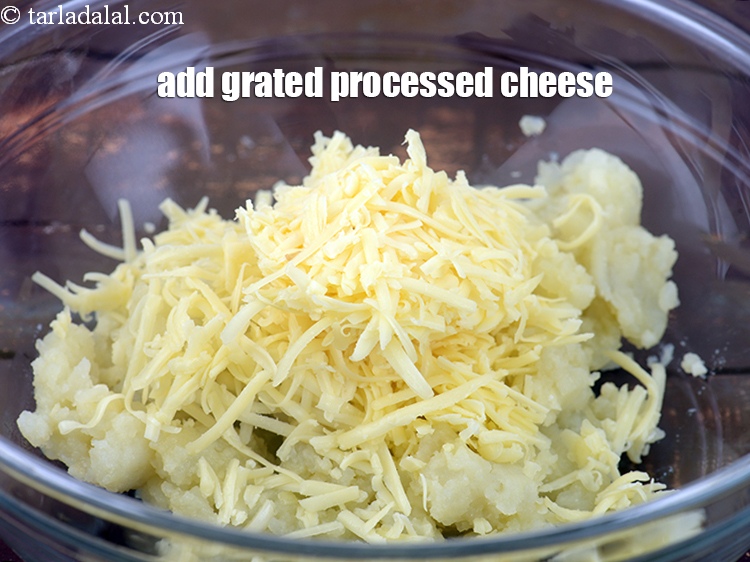 Step 9 – Add 1/2 cup <a href="https://www.tarladalal.com/glossary-grated-processed-cheese-868i">grated processed cheese</a>.