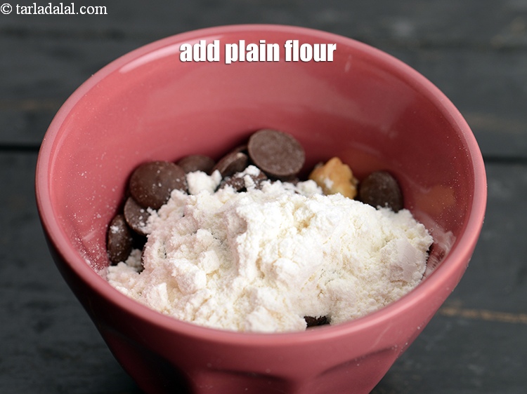 Step 9 – Add 1 tsp <a href="https://www.tarladalal.com/glossary-plain-flour-maida-188i">plain flour (maida)</a>.