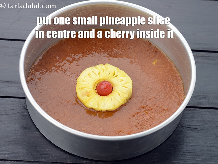 Step 9 – Put one small fresh&nbsp;<a href="https://www.tarladalal.com/glossary-pineapple-ananas-88i">pineapple</a>&nbsp;slice in the centre and a <a href="https://www.tarladalal.com/glossary-glace-cherry-31i">glace cherry</a>&nbsp;inside it.&nbsp;