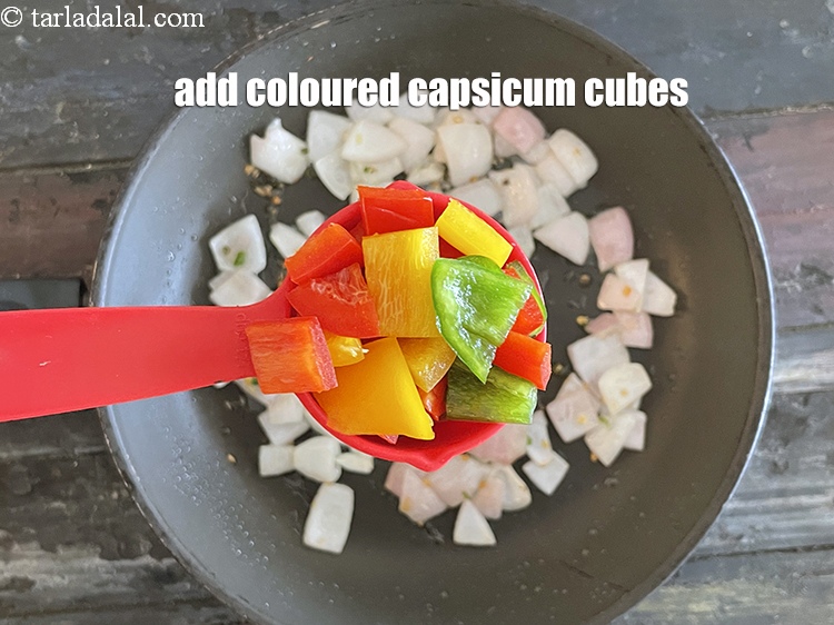 Step 16 – <meta charset="UTF-8" />Add 1/4 cup coloured&nbsp;capsicum cubes.