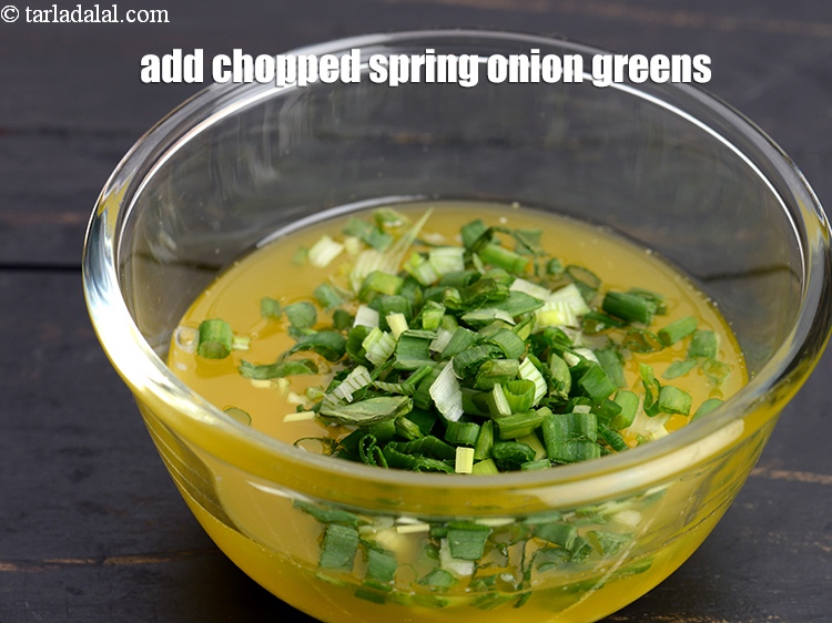 Step 9 – Add 2 tbsp <a href="https://www.tarladalal.com/glossary-chopped-spring-onion-greens-1030i">chopped spring onion greens</a>.