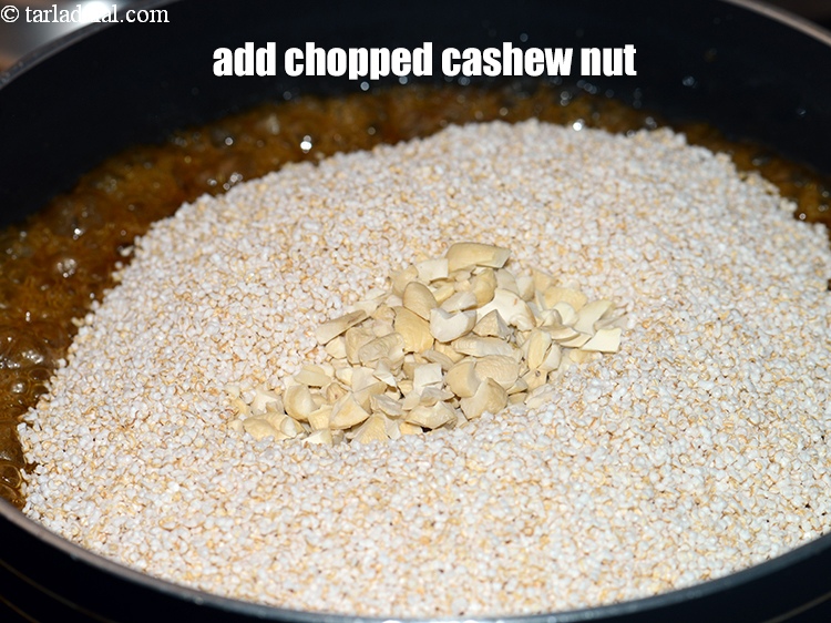 Step 11 – Add &frac14; cup <a href="https://www.tarladalal.com/glossary-chopped-cashew-nut-791i">chopped cashew nut (kaju)</a>.