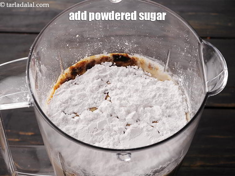 स्टेप 14 – ३/४ कप <a href=""https://www.tarladalal.com/glossary-powdered-sugar-hindi-280i"">पीसी हुई चीनी</a> डालें।