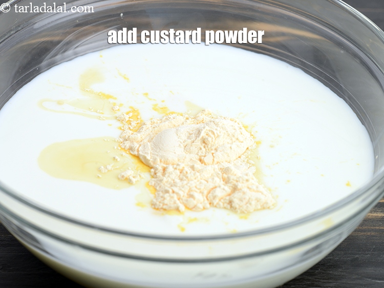 Step 9 – Add 1 tbsp <a href="https://www.tarladalal.com/glossary-custard-powder-512i">custard powder</a>.
