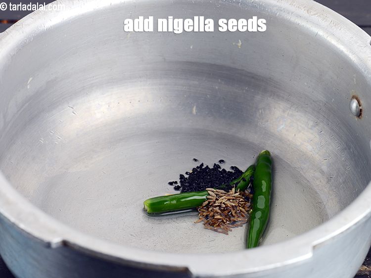 Step 9 – Add &frac14; tsp <a href="https://www.tarladalal.com/glossary-nigella-seeds-kalonji-onion-seeds-552i">nigella seeds (kalonji)</a>.