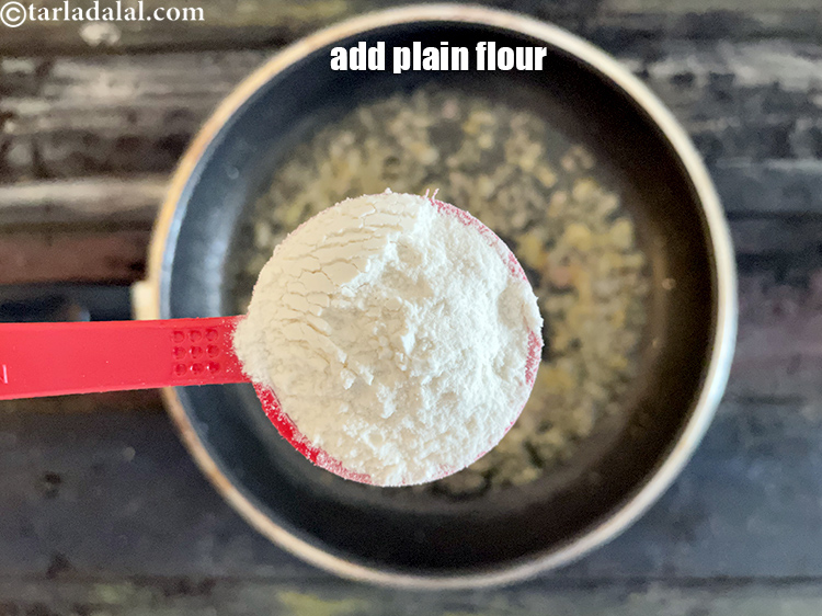 Step 9 – Add 2 tbls plain flour ( maida).