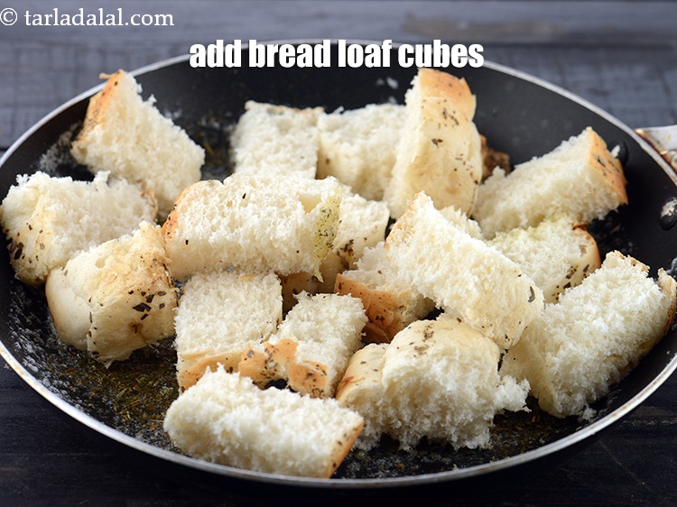 Step 9 – Add 2 cups&nbsp;<a href="https://www.tarladalal.com/glossary-bread-loaf-cubes-2314i">bread loaf cubes</a>.