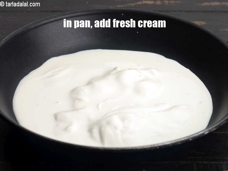 Step 9 – In a broad non-stick pan, add 1 cup <a href="https://www.tarladalal.com/glossary-fresh-cream-1877i">fresh cream</a>.