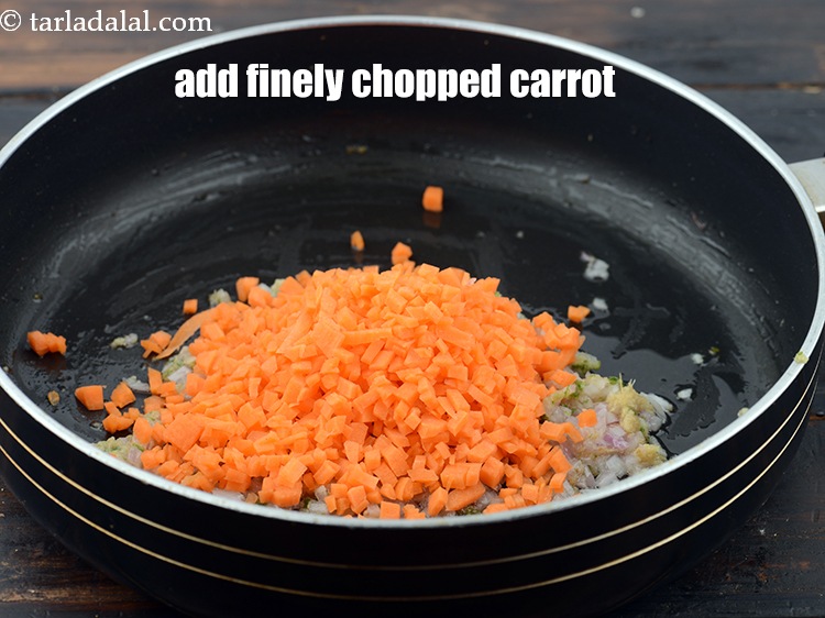 Step 9 – Add 1/2 cup&nbsp;finely&nbsp;<a href="https://www.tarladalal.com/glossary-chopped-carrot-798i">chopped carrot</a>.