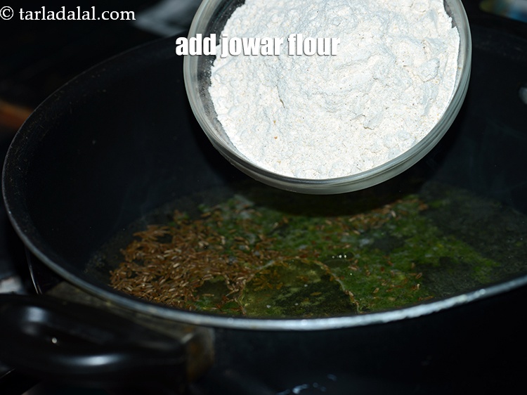 Step 9 – Add 1 1/4 cups&nbsp;<a href="https://www.tarladalal.com/glossary-jowar-flour-jowar-ka-atta-white-millet-flour-sorghum-flour-483i">jowar (white millet) flour</a>.