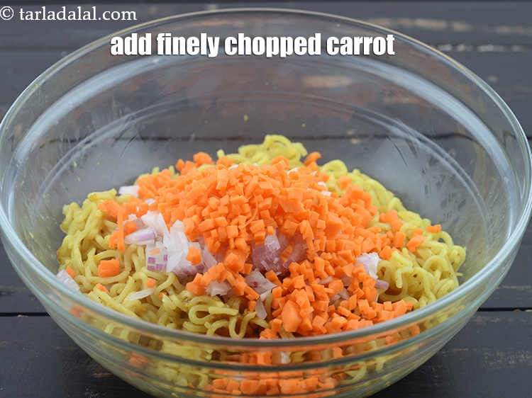 Step 10 – Add 1/4 cup&nbsp;finely&nbsp;<a href="https://www.tarladalal.com/glossary-chopped-carrot-798i">chopped carrot</a>.