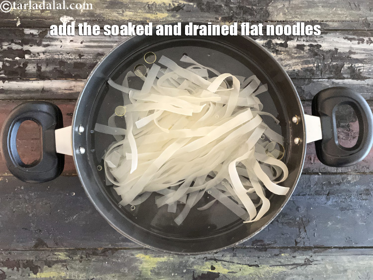 Step 9 – Add the drained flat noodles.