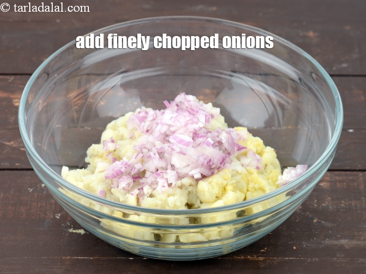 Step 10 – Add 1/4 cup&nbsp;finely&nbsp;<a href="https://www.tarladalal.com/glossary-chopped-onions-722i">chopped onions</a>.