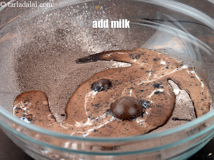 Step 9 – Add 8 tbsp <a href="https://www.tarladalal.com/glossary-milk-doodh-full-cream-milk-514i">milk</a>.