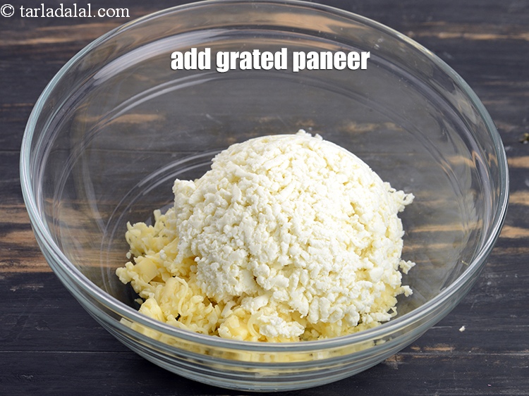 Step 10 – Add 1 cup <a href="https://www.tarladalal.com/glossary-grated-panee-1003i">grated paneer (cottage cheese)</a>.