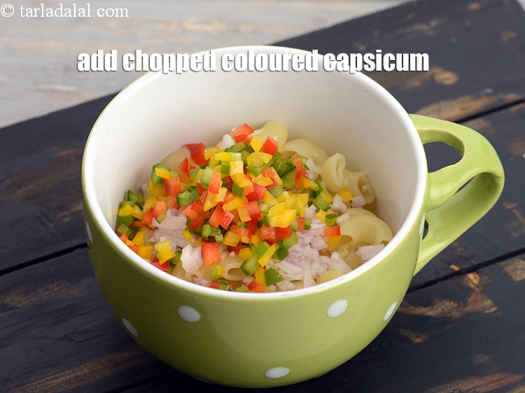 Step 9 – Add 2 tbsp of <a href="https://www.tarladalal.com/glossary-chopped-coloured-capsicum-2800i">chopped coloured capsicum</a>.