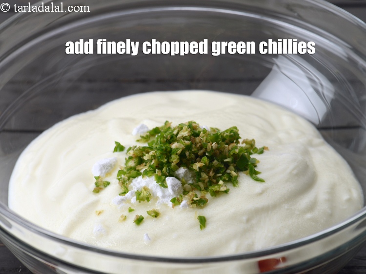 Step 9 – Add 2 tsp finely <a href="https://www.tarladalal.com/glossary-chopped-green-chilli-820i">chopped green chillies</a>.