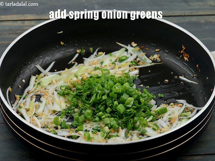 Step 19 – Add the 1/4 cup&nbsp;finely&nbsp;<a href="https://www.tarladalal.com/glossary-chopped-spring-onion-greens-1030i">chopped spring onion greens</a>.&nbsp;