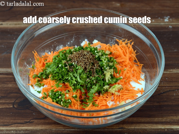 Step 9 – Add 1 tsp coarsely <a href="https://www.tarladalal.com/glossary-roasted-and-crushed-cumin-seeds-2206i">crushed cumin seeds (jeera)</a>.