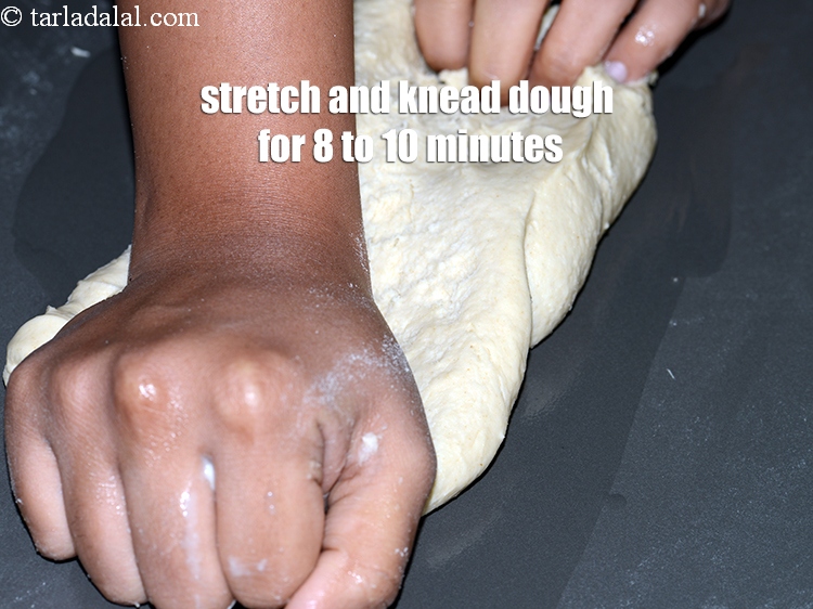 Step 10 – Stretch and knead the dough for 8 to 10 minutes until soft.